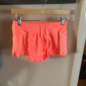 Bright coral Nike shorts